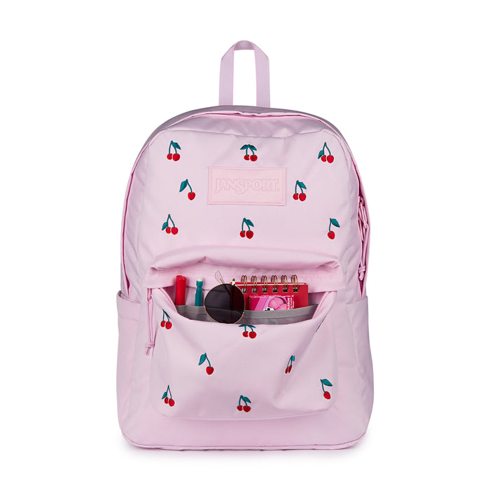 Pink cherry-print backpack with open front pocket and visible supplies inside
