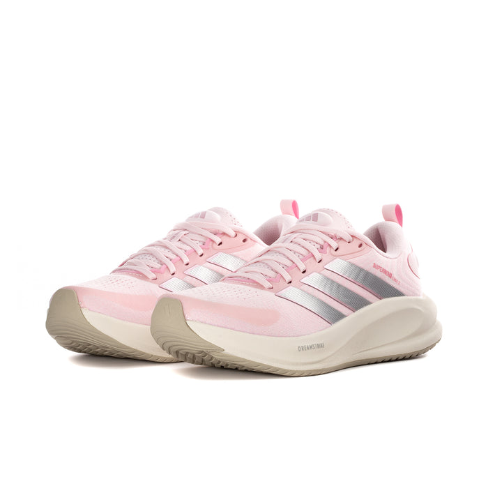 Women's pink athletic sneaker, side view with silver stripes and chunky cream sole