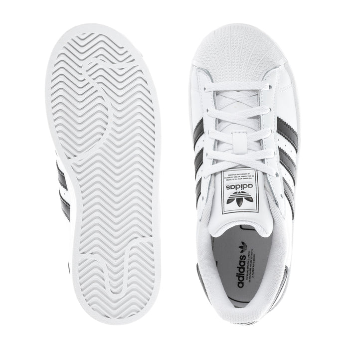 Kids' adidas low-top sneakers, outsole tread and side view with white upper and black stripes