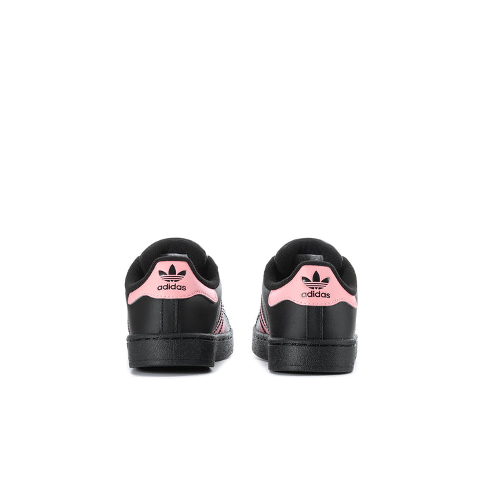 Kids' adidas sneakers, black heel with adidas logo and pink collar accents