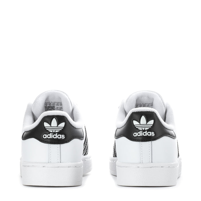 Kids' adidas low-top sneakers, heel view with black adidas logo and white cupsole