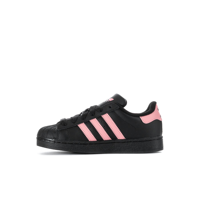 Kids' adidas sneakers, black leather-look upper with pink triple stripes