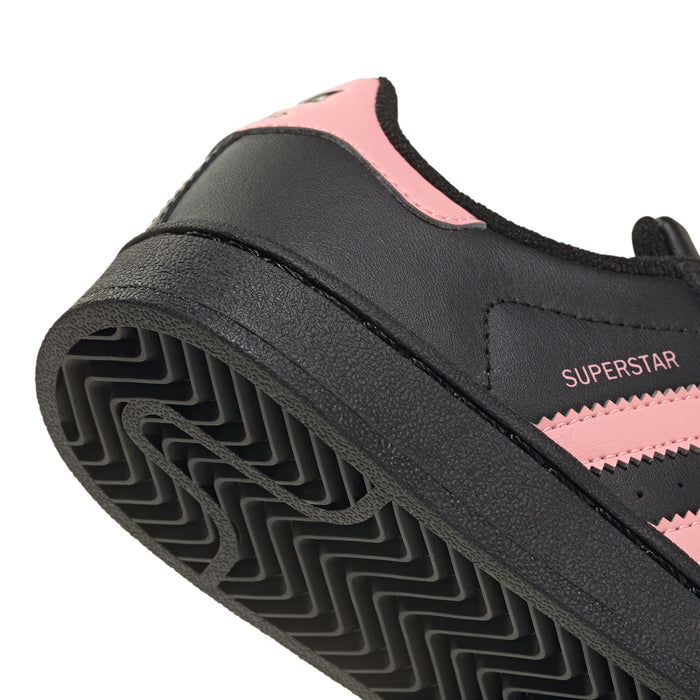 Kids' adidas sneakers heel outsole, textured grip with black and pink accents