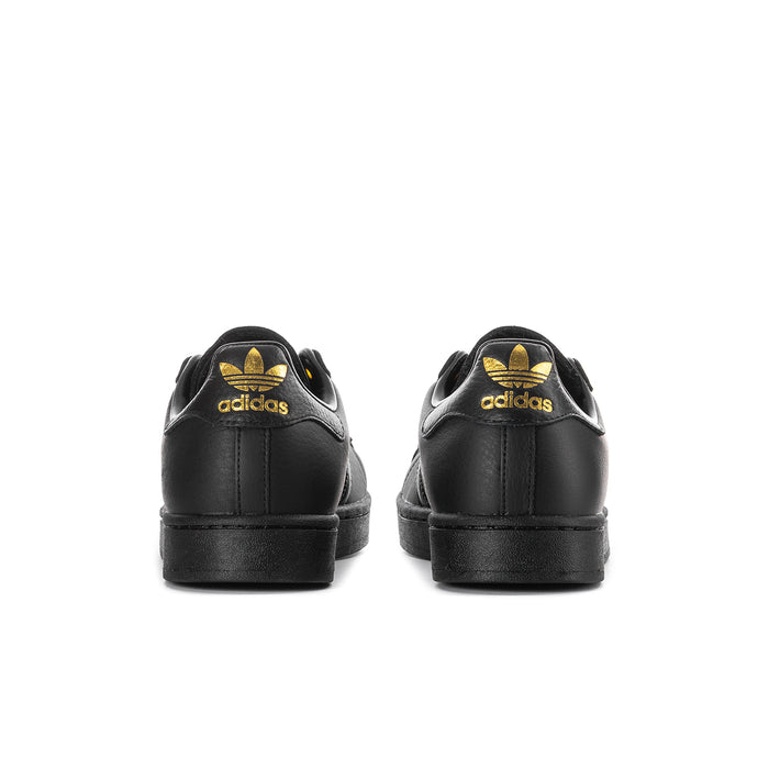 Men's black Adidas sneakers, back view with gold trefoil logo on heel.