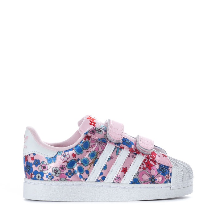 Toddler low-top sneakers with colorful floral print and pink hook-and-loop strap.
