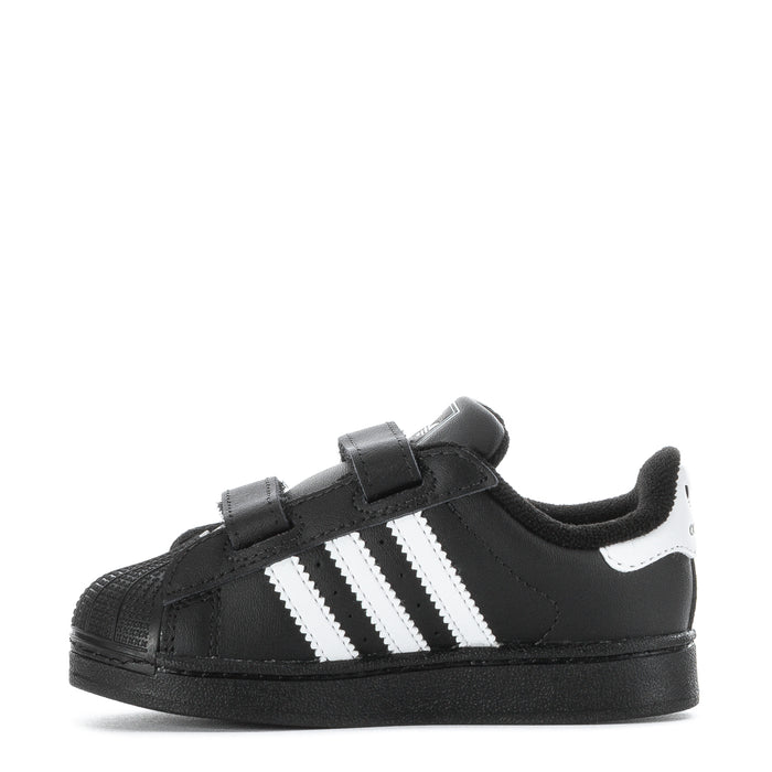 Toddler black sneakers with three white stripes and dual Velcro closures
