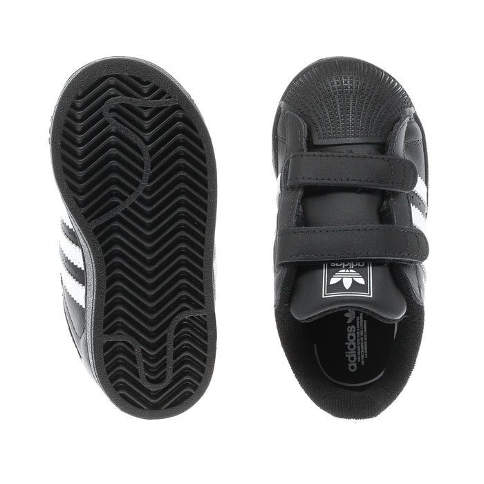 Toddler black sneakers with treaded outsole and Velcro strap detail