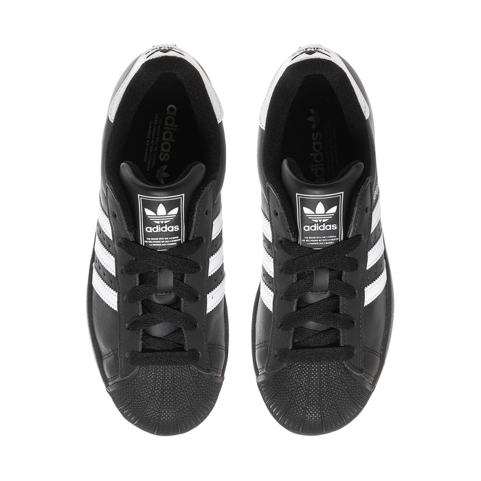 Women’s adidas Superstar II sneakers showing black interior lining and lace-up tongue