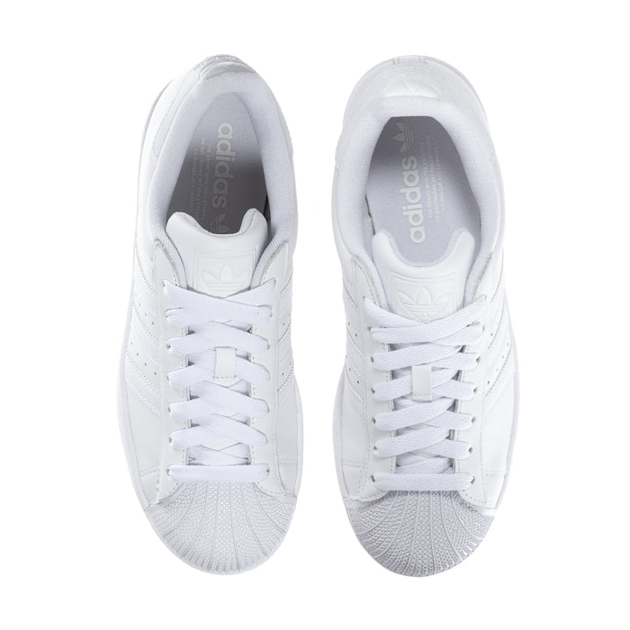 White womens sneakers front view with white laces and perforated toe panel