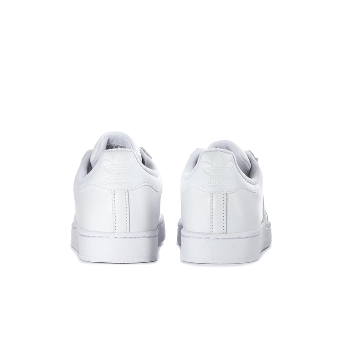 White womens low-top sneakers with rear heel tab and cushioned back collar