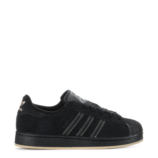 Youth black low-top sneakers with three-striped design and lace-up closure.