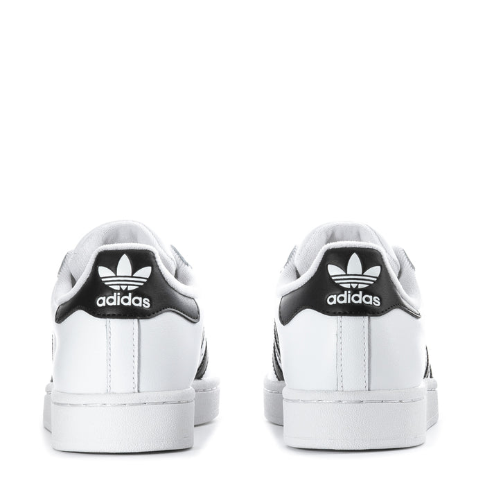 adidas Superstar II youth sneakers, back view in white with black adidas heel tab