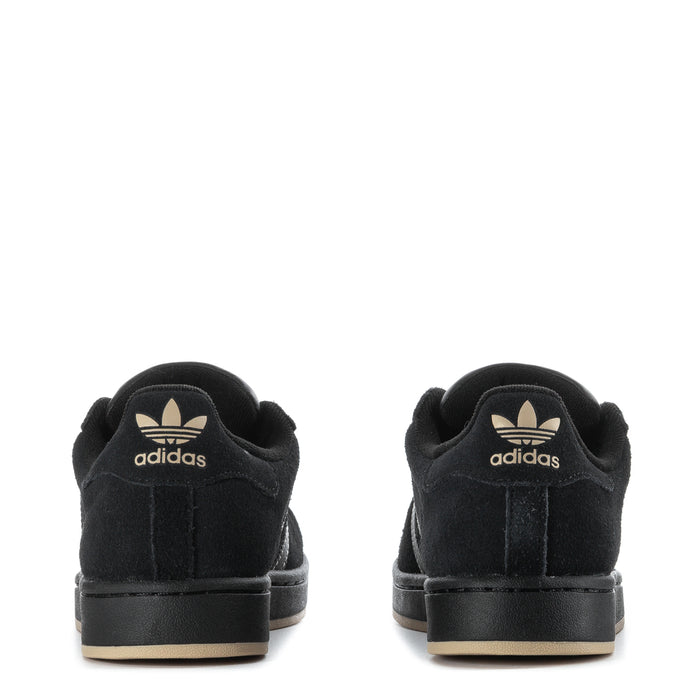 Youth black sneakers, heel view with adidas logo and low rubber sole.