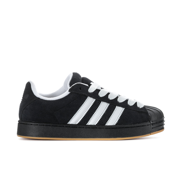 Black and white men's low-top sneakers with three stripe detail and gum sole.