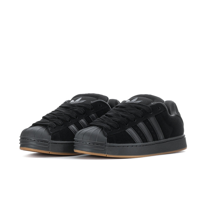 Superstar ST men's sneakers, side view pair, black upper with striped detailing and gum sole