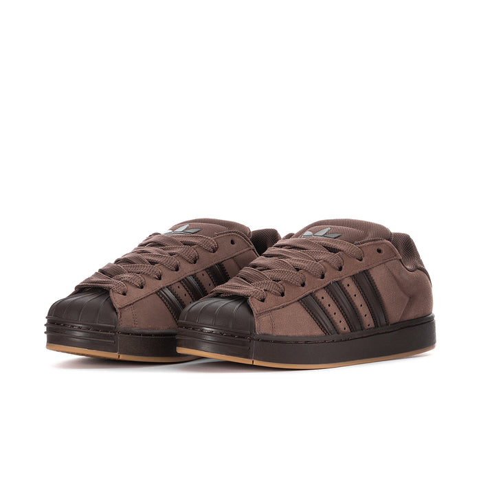 Men's brown suede sneakers, two shoes shown, three-stripe design and lace-up