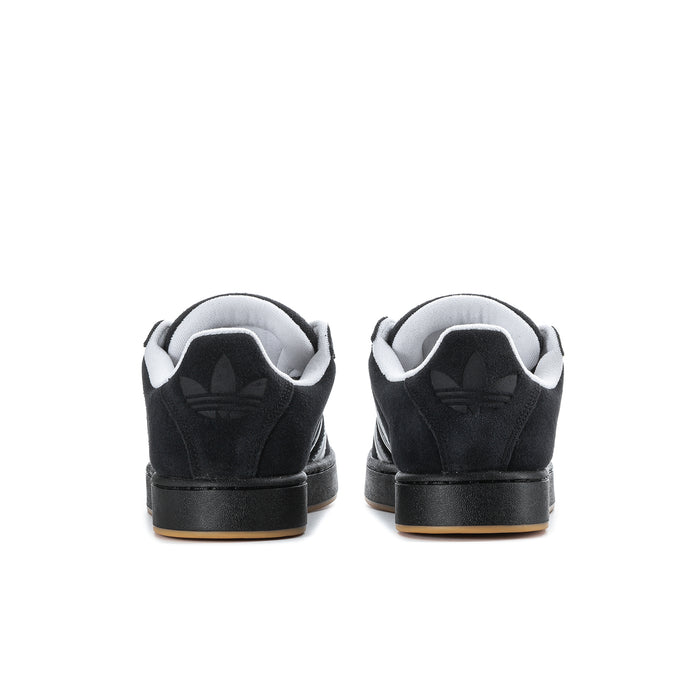 Black men's low-top sneakers from the heel, showing adidas branding and gum outsole.