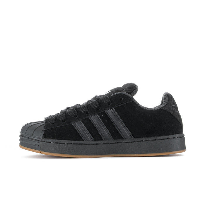 Superstar ST men's sneakers, side profile, black upper with three stripe details and gum outsole