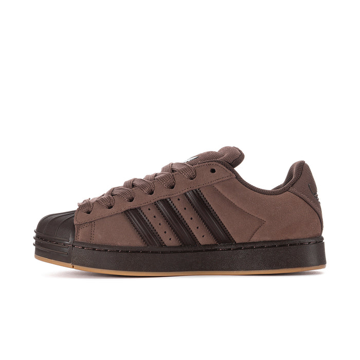 Men's brown suede lace-up sneakers with three black stripes and gum outsole