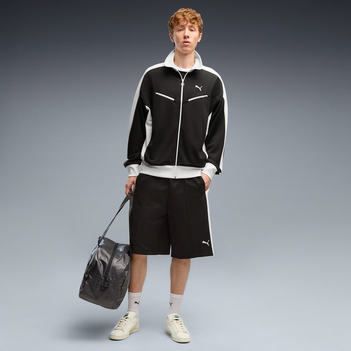 Black baggy men's shorts with elastic waistband and PUMA logo on hem