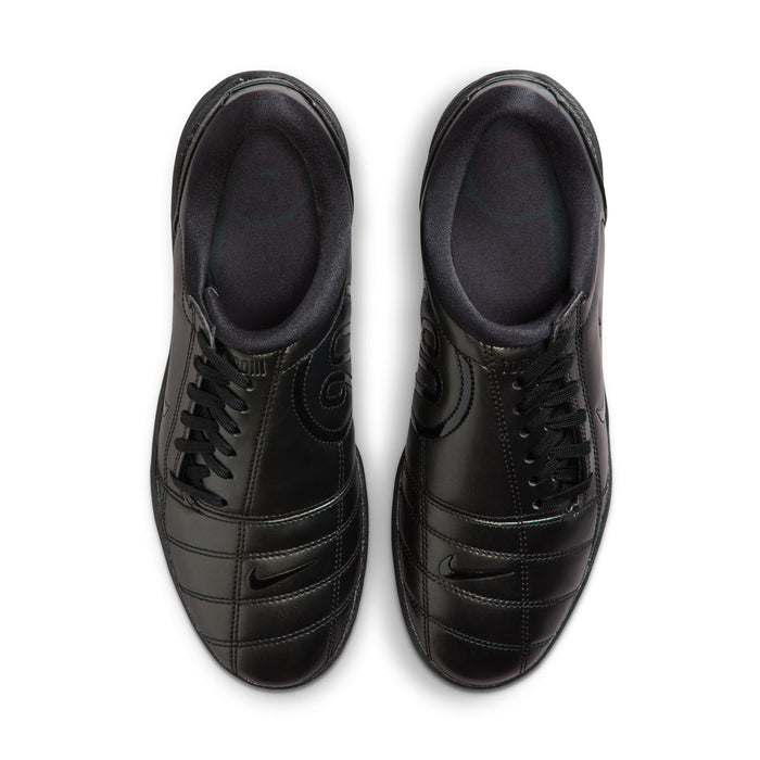 Pair of women's black Nike sneakers with laces and swoosh, top view