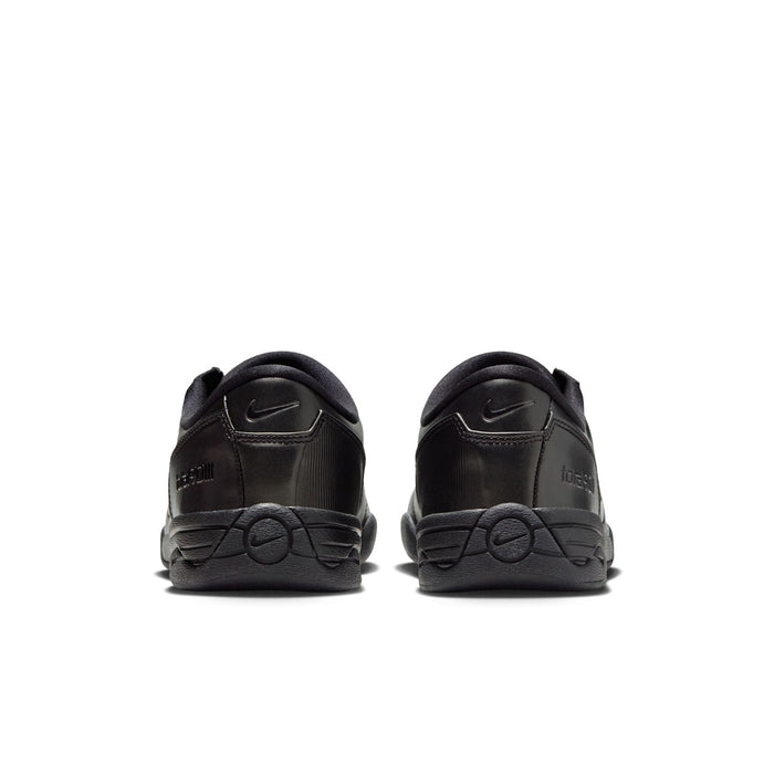Women's black Nike sneakers with heel tabs and swoosh, back view