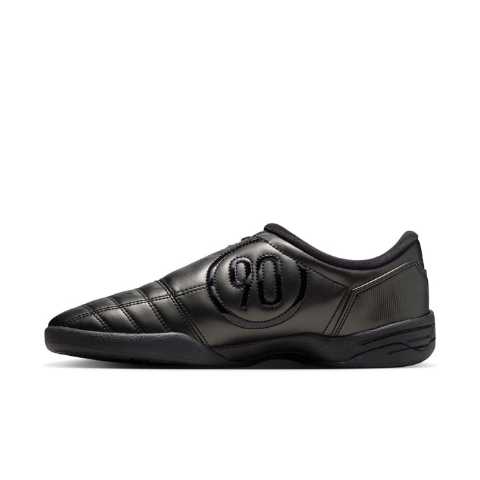 Women's black Nike sneakers with large oval logo and lace-up front