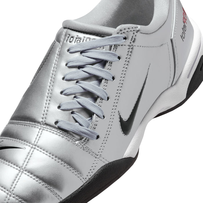 Metallic silver upper with light gray laces and black Nike swoosh.