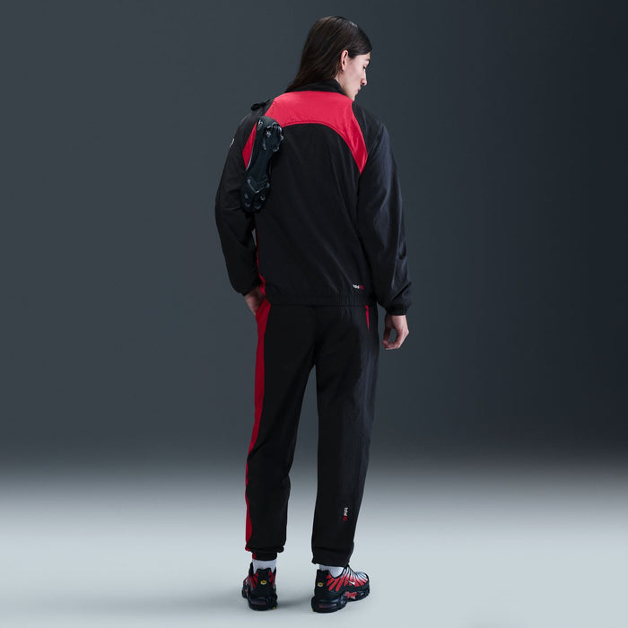 Men's black track pants with red back yoke and side stripe; Nike swoosh