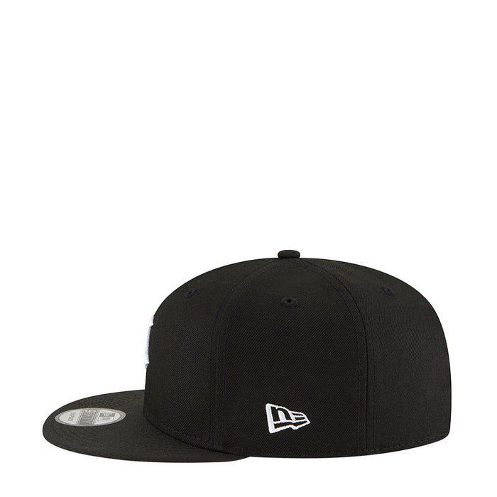 Black baseball cap with white New Era logo on front