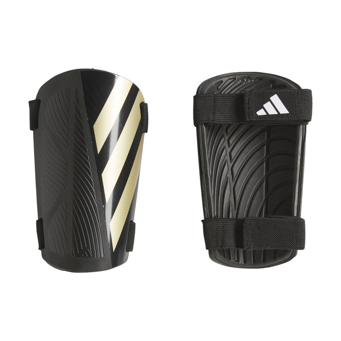 Black shin guard pair with adjustable straps and metallic gold-and-white diagonal stripes