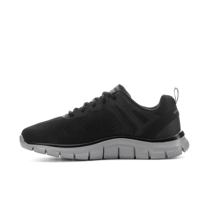 Men's wide black lace-up running shoe with mesh panels and thick gray traction sole