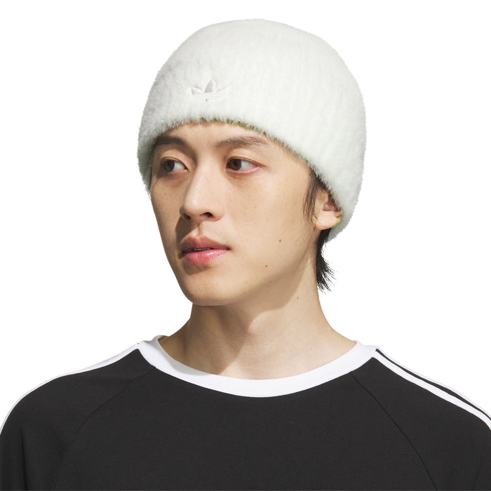 Off-white knit beanie with cuff and trefoil logo, worn on model