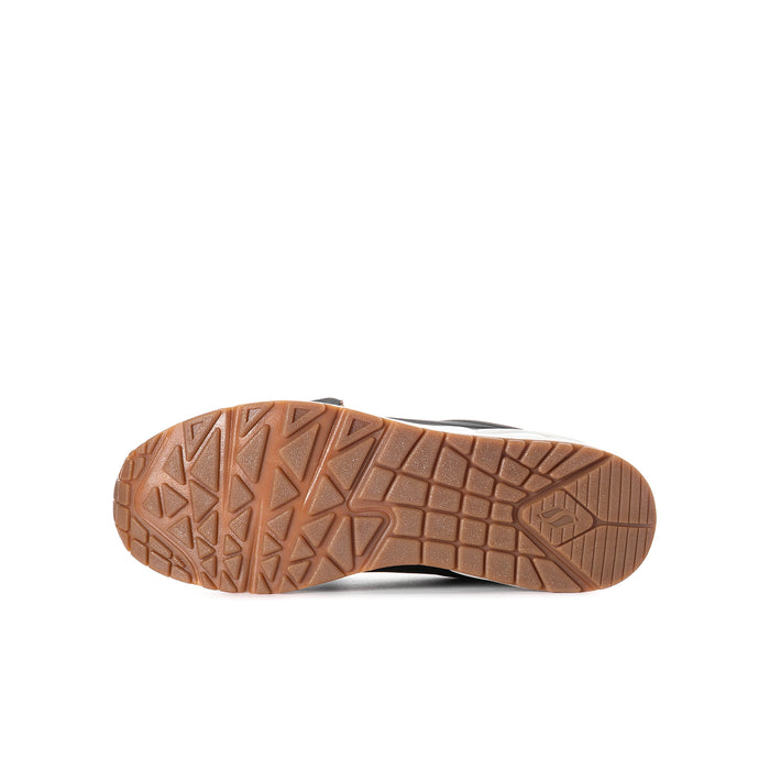 Youth sneaker outsole in brown rubber with tread pattern