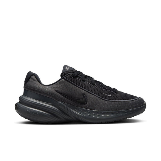Women's black knit running shoes with lace-up, Nike swoosh, and cushioned midsole