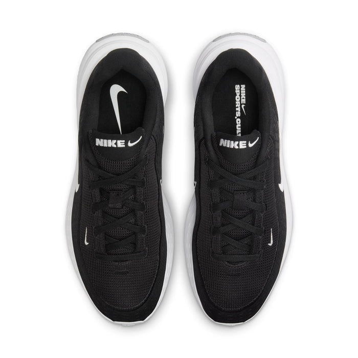 Pair of black women's sneakers with white swooshes on front and black laces