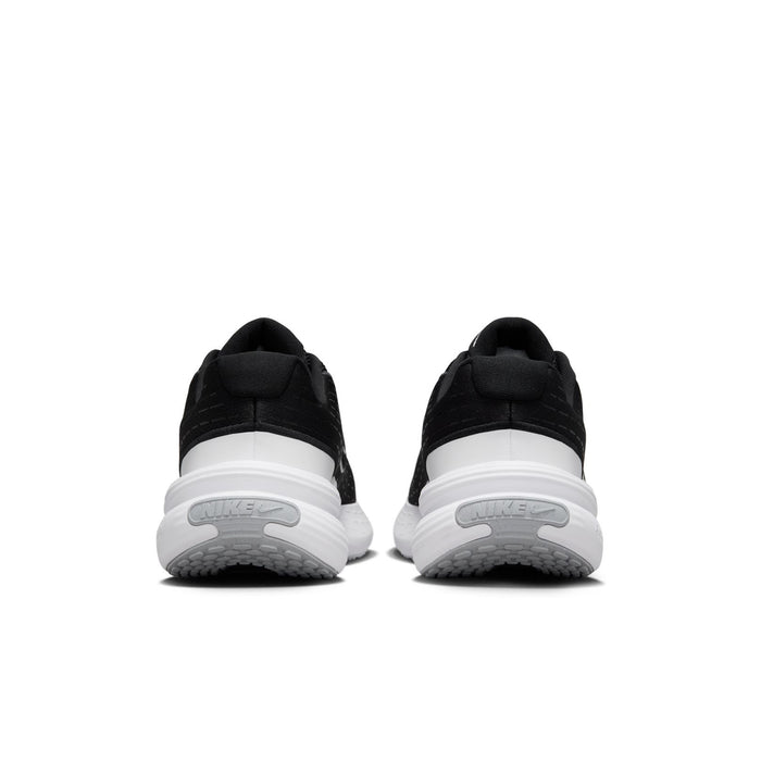 Black women's sneakers with white heel details and cushioned platform sole