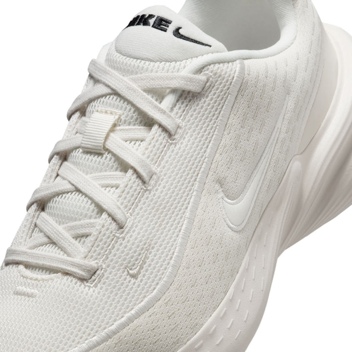 Women's running shoe, close-up of white laces and textured knit upper with Nike Swoosh