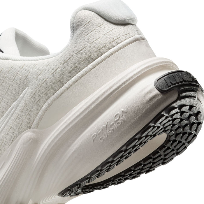 Women's running shoe close-up, side wall and outsole tread with Nike heel detail