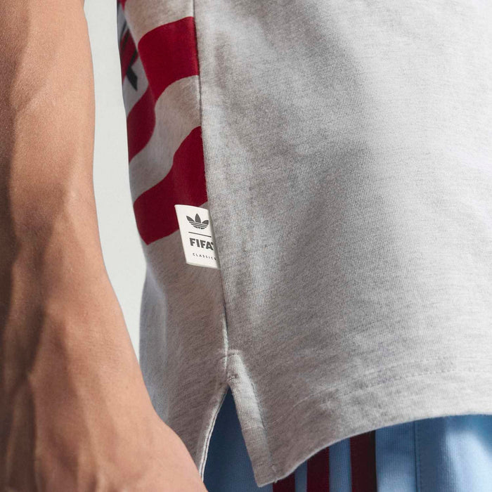 Heather gray T-shirt sleeve detail with red-and-white flag graphic label