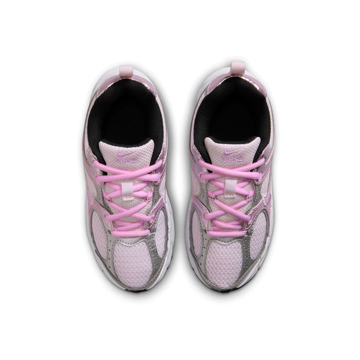 Pair of kids sneakers viewed from above with pink laces and black inner lining