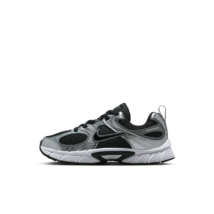 Kids Nike sneaker, black laces, gray panels, and white midsole with Swoosh