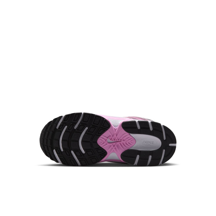 Kids sneakers outsole view with pink highlights and textured tread