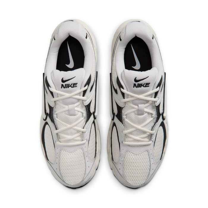 Pair of men's running shoes, light gray uppers with black swooshes and white laces