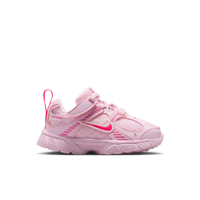 Toddler pink lace-up sneaker with hook-and-loop strap and white-pink swoosh logo