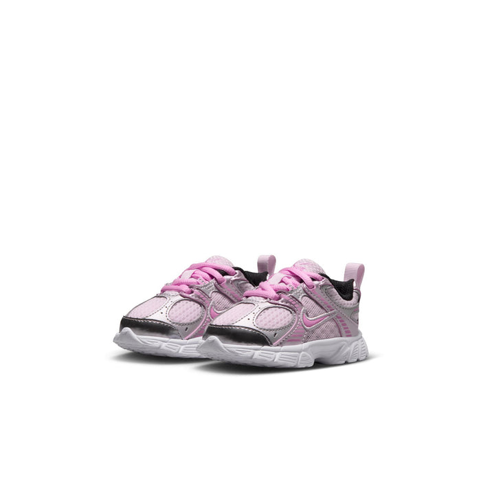 Toddler running shoe angled view in light pink and metallic silver with pink laces