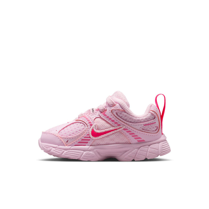 Toddler pink lace-up sneaker with contrast swoosh and raised side stripes