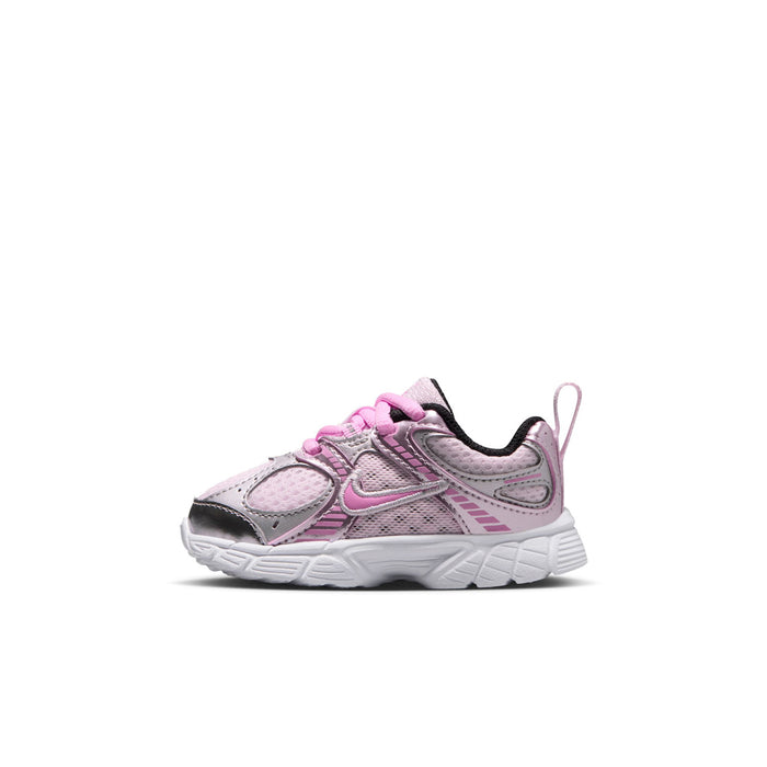 Toddler running shoe side view with light pink upper, metallic silver panels, and pink laces