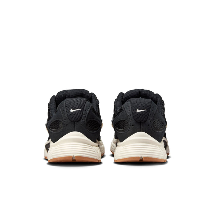 Black womens sneakers with white midsole and tan gum outsole, Nike heel logo