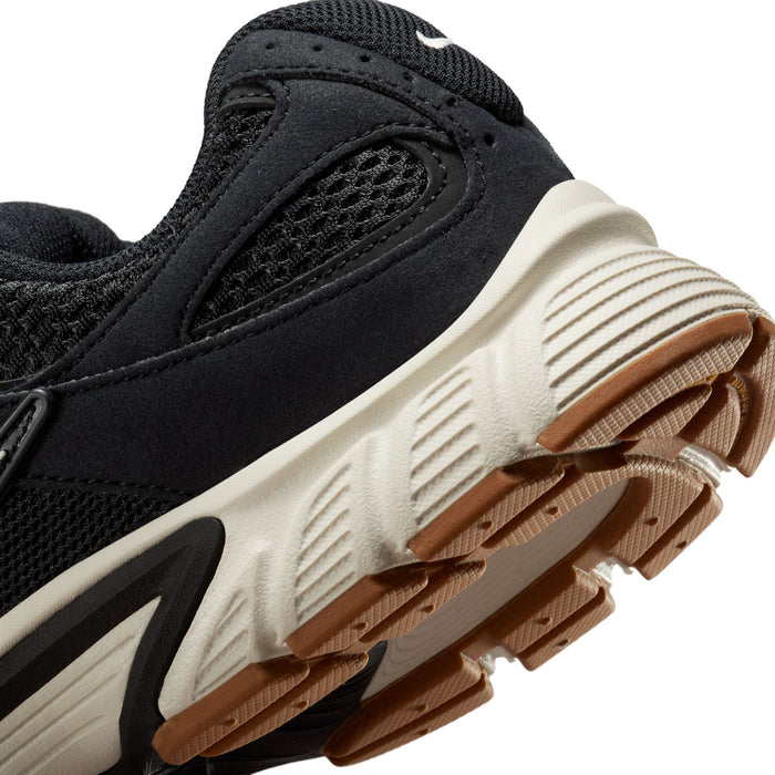 Black womens sneakers heel and outsole detail with white midsole and gum tread